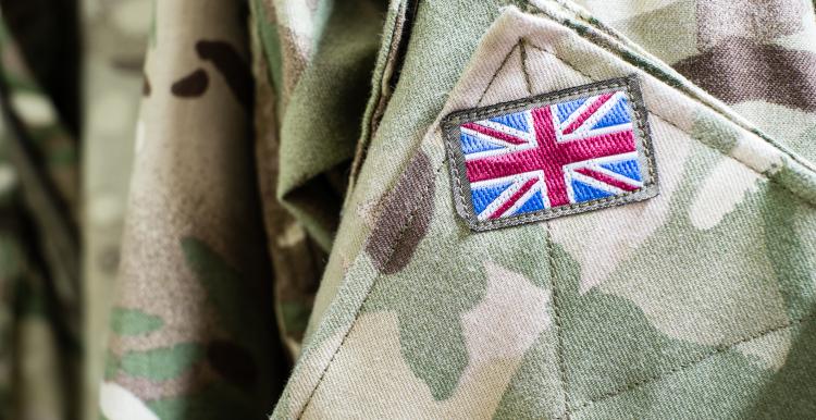 Close up image of a solder uniform with a Union Jack flag badge