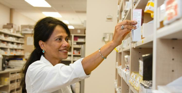 a pharmacist holding medication