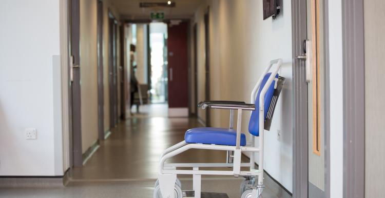 Hospital corridor with empty wheelchair