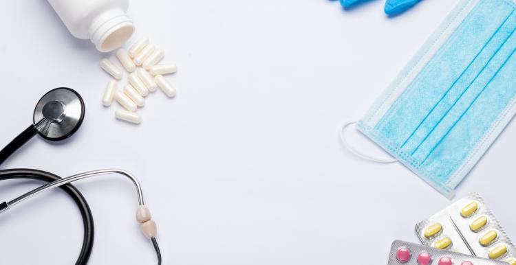 Stethoscope with medication, masks and gloves