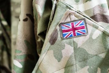 Close up image of a solder uniform with a Union Jack flag badge